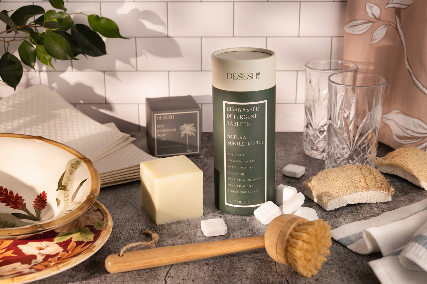 This image shows a pack of 10 unbranded and plain Swedish dish clothes for a more sustainable, eco friendly, zero waste, plastic free cleaning routine. Also shown in the image are various other plastic free dishwashing products