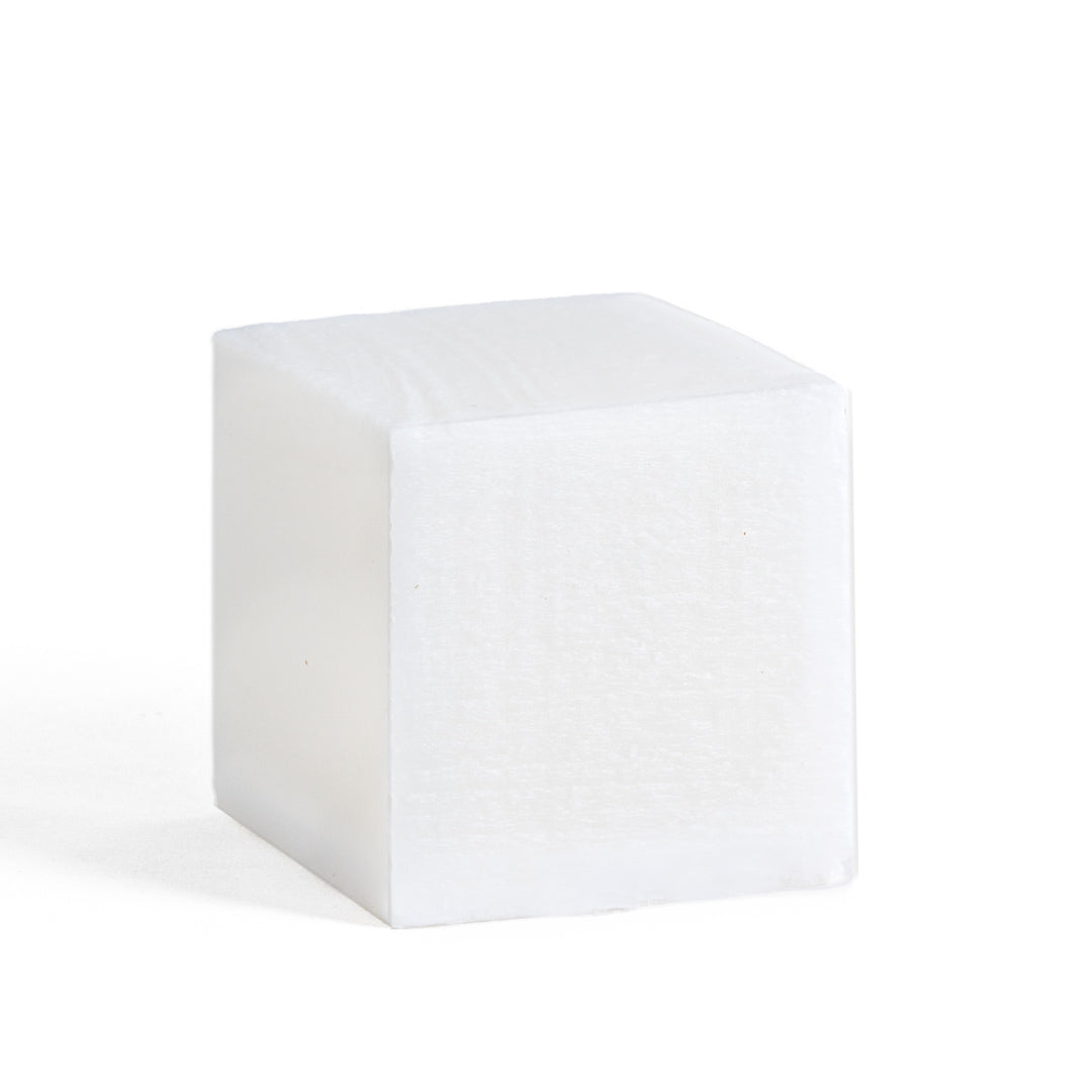This image shows the Desesh laundry stain soap cube which is used to remove stains on clothes and fabrics. It is a plastic free alternative to stain sticks. It is designed for an eco friendly zero waste more sustainable routine. This image shows the stain remover soap bar without the packaging