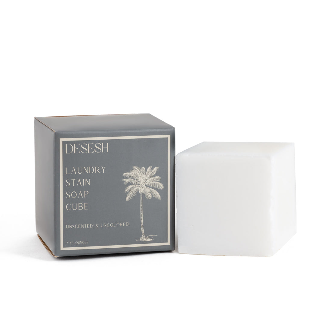 This image shows the Desesh laundry stain soap cube which is used to remove stains on clothes and fabrics. It is a plastic free alternative to stain sticks. It is designed for an eco friendly zero waste more sustainable routine