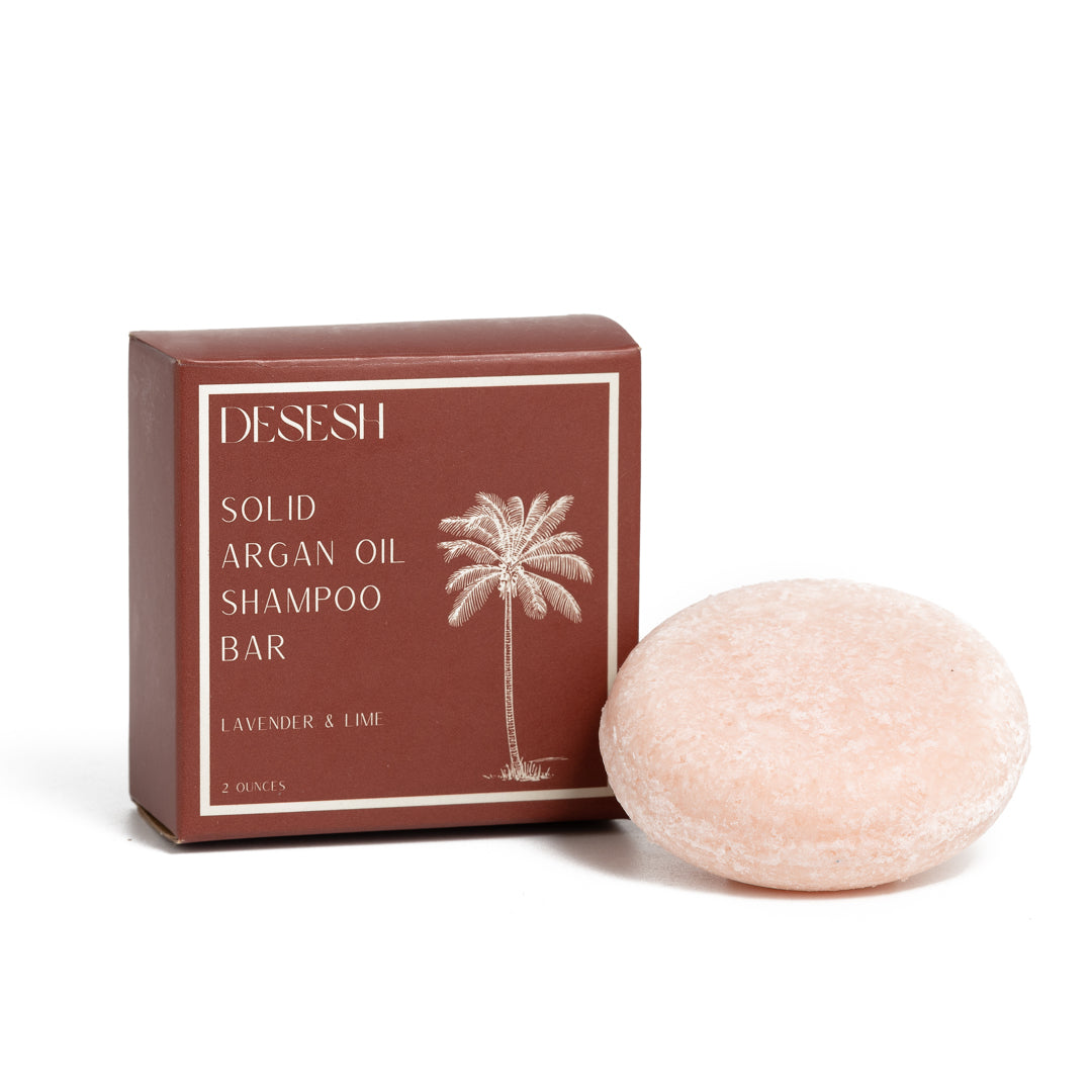 This image shows salon quality Argan Oil Shampoo bars with plastic free biodegradable packaging for a more sustainable eco friendly zero waste hair care routine. Shown here is the Lavender and Lime solid shampoo bar that has no artificial colors or fragrances.