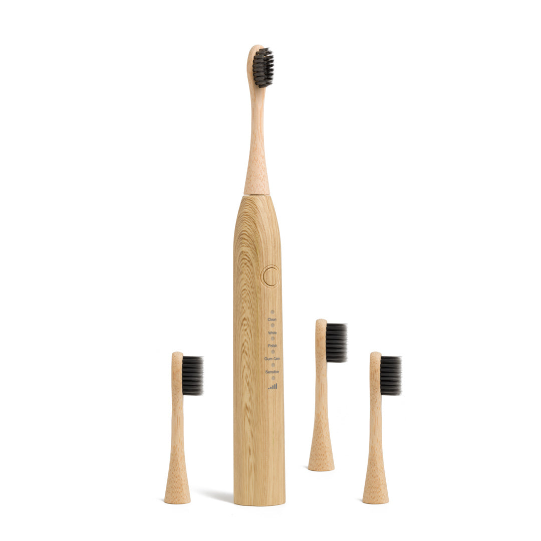 This image shows the Desesh bamboo sonic electric toothbrush which is USB-rechargable and comes with replacement bamboo heads for a more sustainable eco friendly plastic free dental and oral care routine