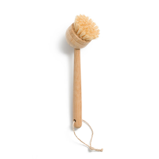 This image shows a plastic free bamboo dish scrubbing tool for a more eco friendly zero waste sustainable dishwashing routine