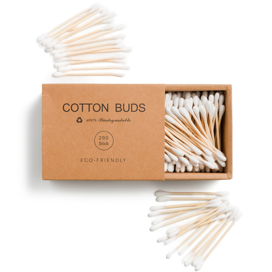 This image shows plastic free bamboo and cotton ear buds in a biodegradable cardboard box for a plastic free more sustainable zero waste skincare routine