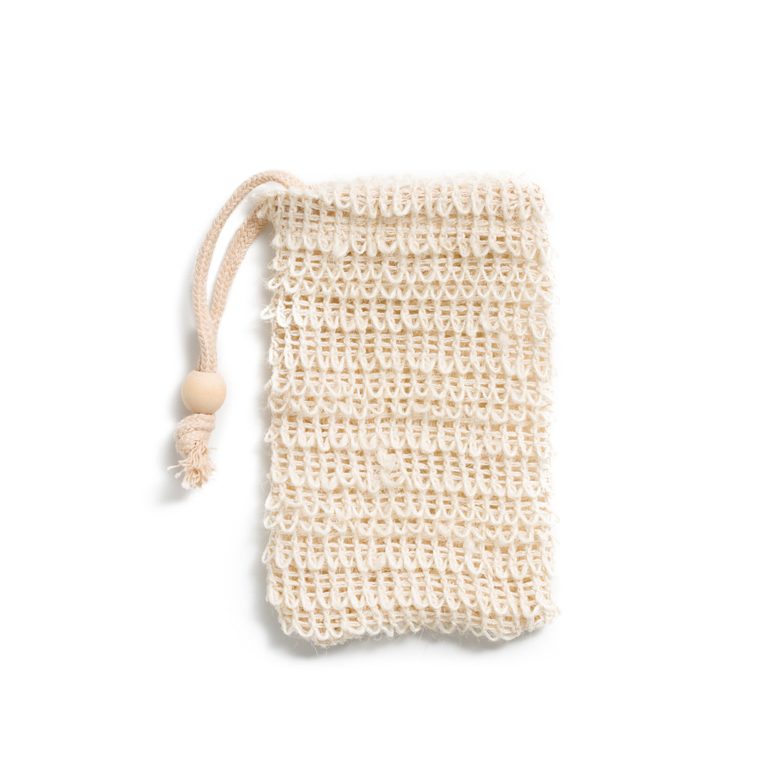 This image shows a cotton sisal soap saver bag. It is used for soap bars and solid shampoos and conditioners to extend the life of the bars and keep the bars dry. This is for a plastic free zero waste more eco friendly sustainable routine