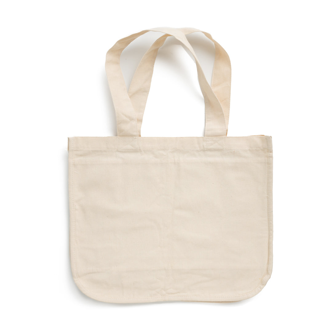 This image shows the Desesh reusable unbranded cotton grocery tote bag for a more sustainable eco friendly plastic free daily routine. There are no logos and no designs on this bag. It is plain and cream colored