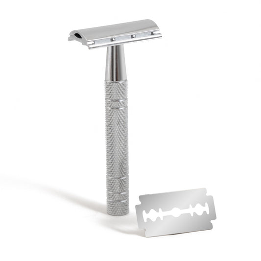 This image shows a metal reusable safety razor for body and face shaving as a plastic free alternative to disposable razors. It comes with replacement blades. It is designed for eco friendly zero waste plastic free more sustainable shaving.