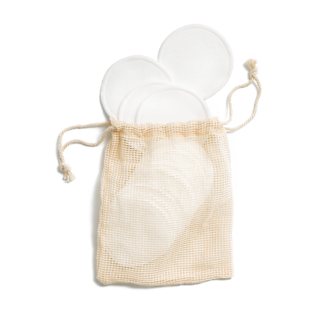 This image shows a pack of 15 reusable machine washable cotton makeup remover pads also known as cotton rounds. These are plastic free. They are designed for a more eco friendly zero waste sustainable routine as they can be washed and reused
