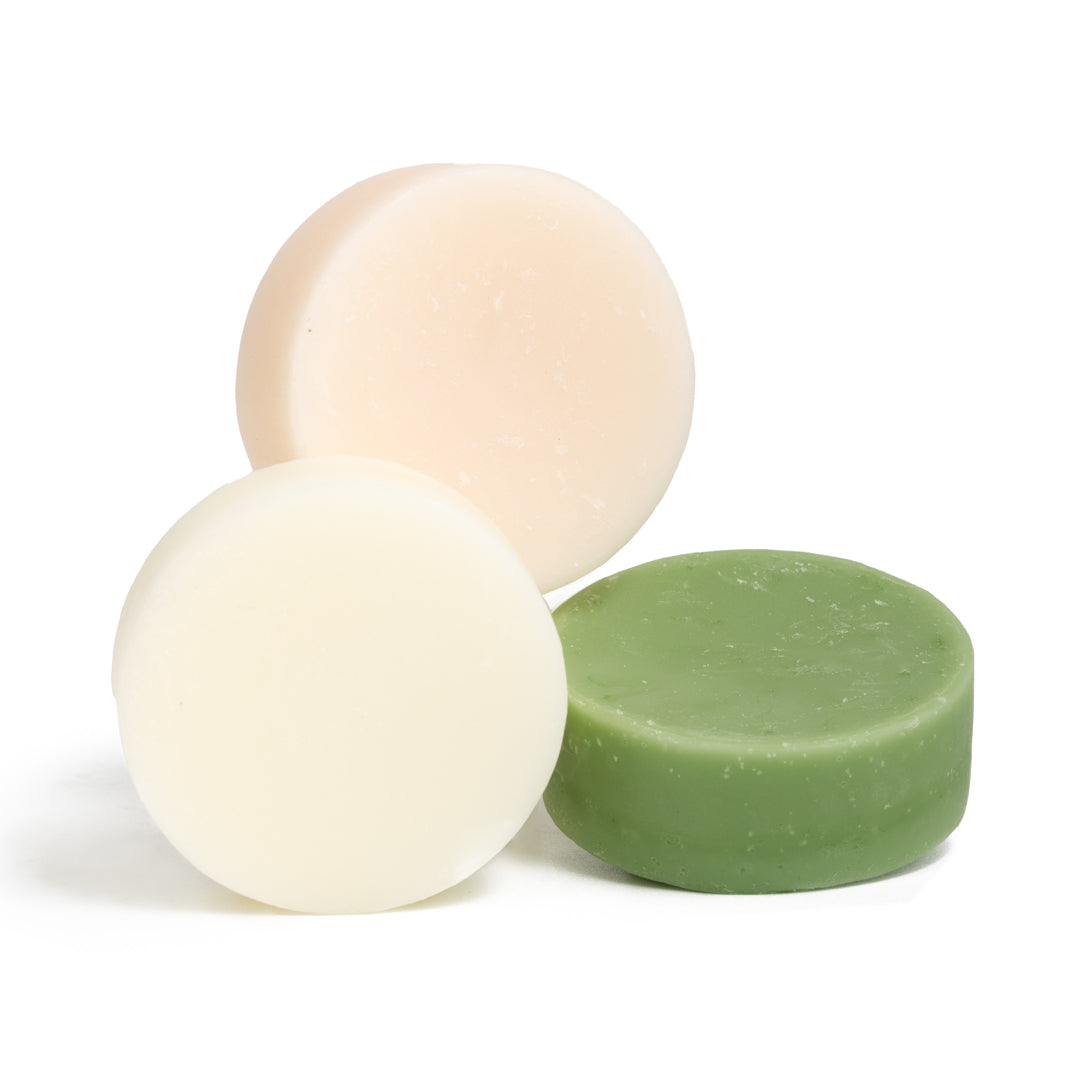 This image shows salon quality Argan Oil solid conditioner bars with plastic free biodegradable packaging for a more sustainable eco friendly zero waste hair care routine. Shown here are the three options without the biodegradable packaging