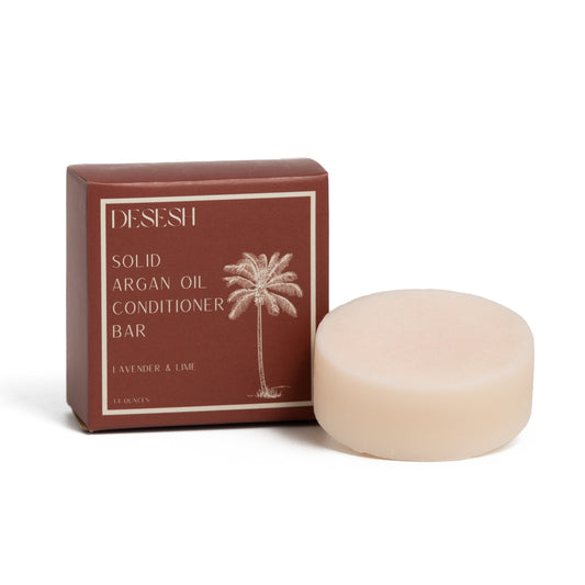 This image shows salon quality Argan Oil solid conditioner bars with plastic free biodegradable packaging for a more sustainable eco friendly zero waste hair care routine. Shown here are the Lavender and Lime bars with natural scents and colors