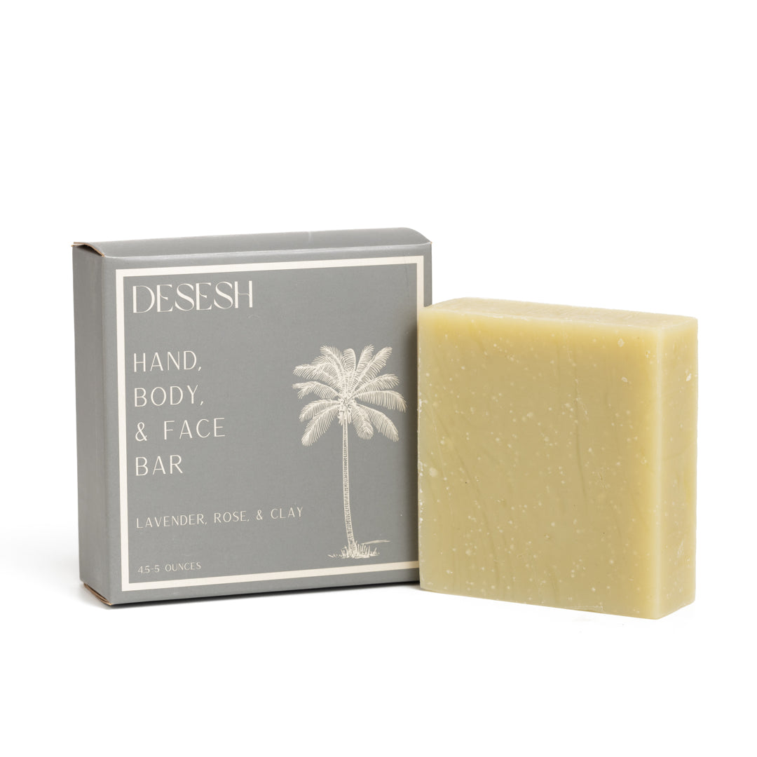 This photo shows the Desesh premium quality US-made small batch body hand and face soap bar with plastic free biodegradable packaging. In the image is the lavender rose and clay soap bar
