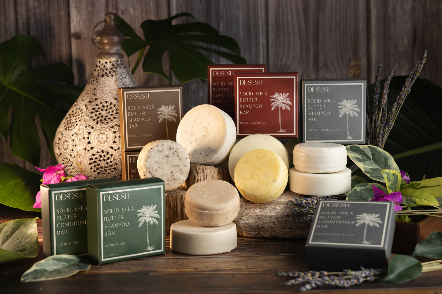 This image shows salon quality Shea Butter solid shampoo bars with plastic free biodegradable packaging for a more sustainable eco friendly zero waste hair care routine. Shown here is the full Desesh collection of solid Shea Butter shampoo and conditioner bars