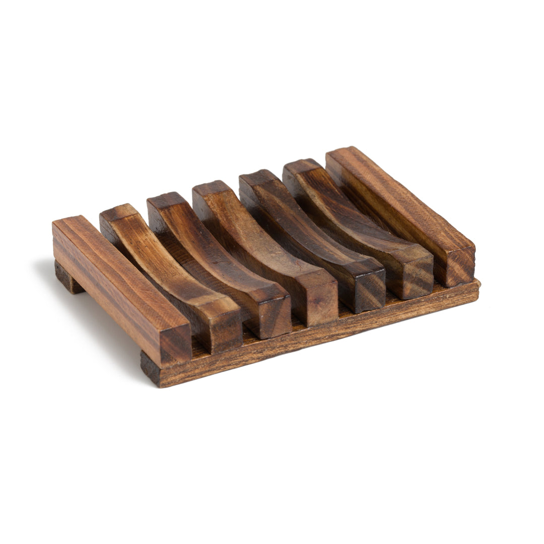 This image shows a dark stained wood soap dish to help keep soap dry. It is rectangular in shape. It is designed for a more eco friendly zero waste sustainable lifestyle and routine